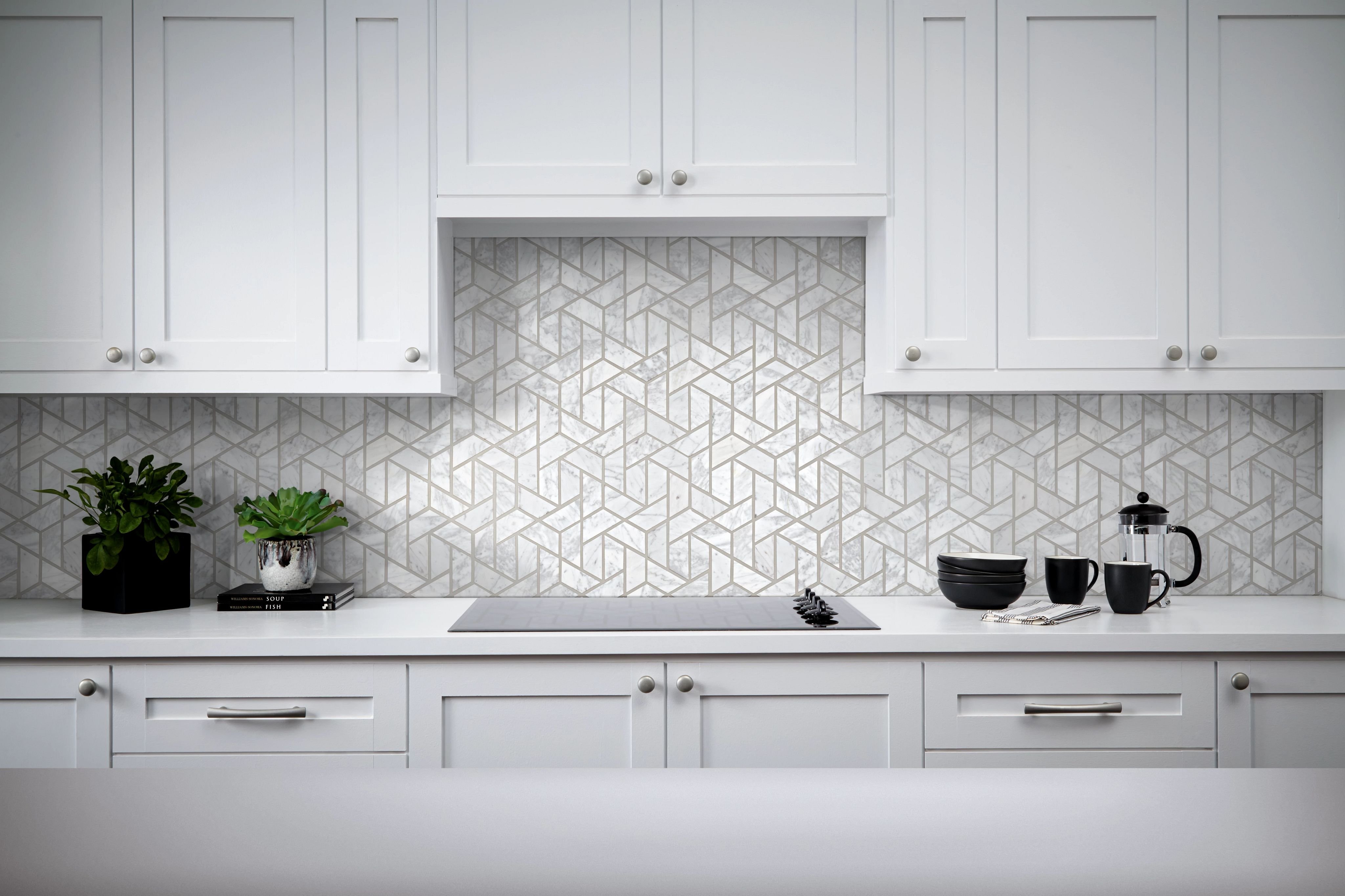 white kitchen countertop and oven with a tiled backsplash from Richardson’s Carpet Service in the Williamsburg, VA area