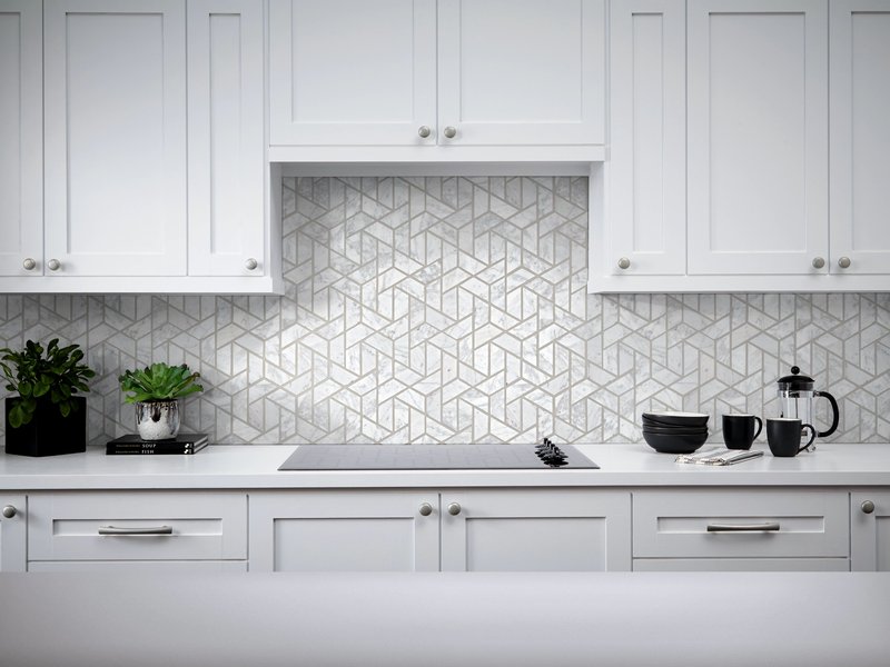 white kitchen countertop and oven with a tiled backsplash from Richardson’s Carpet Service in the Williamsburg, VA area