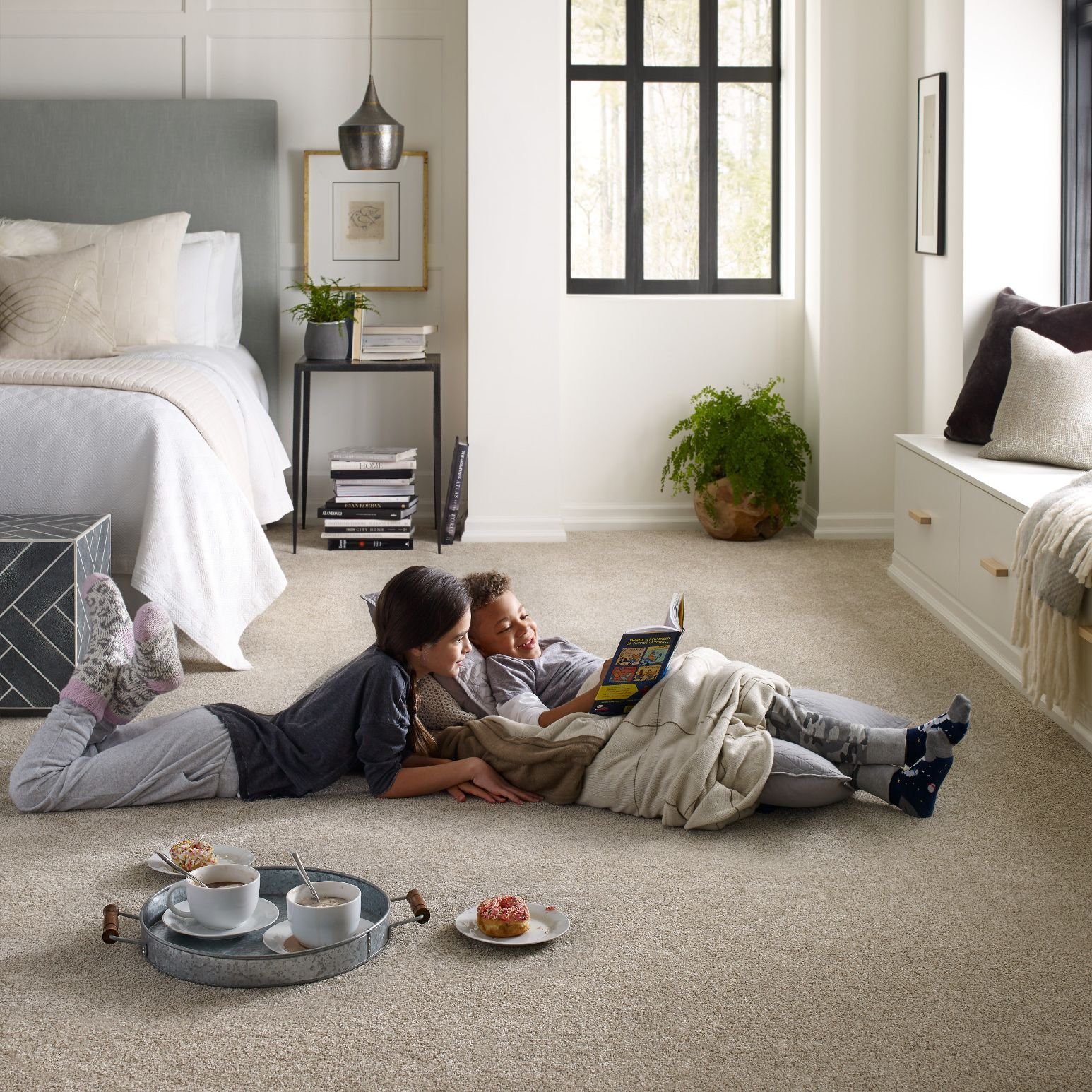 kids reading in bedroom on a soft beige carpet from Richardson’s Carpet Service in the Williamsburg, VA area